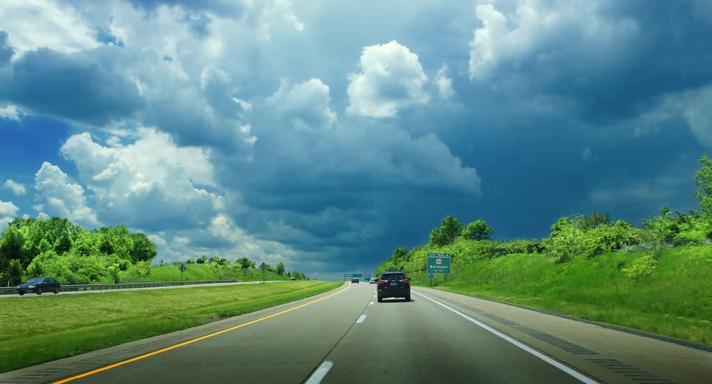 Storm clouds building over a highway